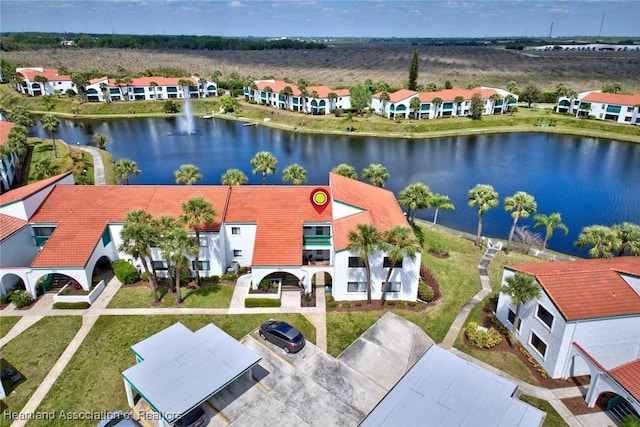 birds eye view of property featuring a residential view and a water view