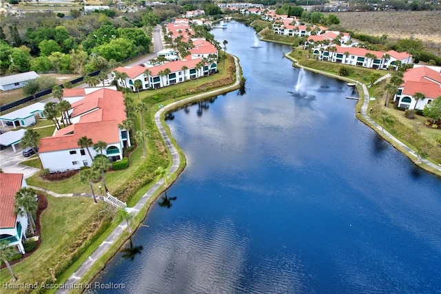 aerial view with a residential view and a water view