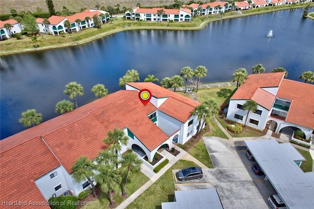 birds eye view of property with a residential view and a water view