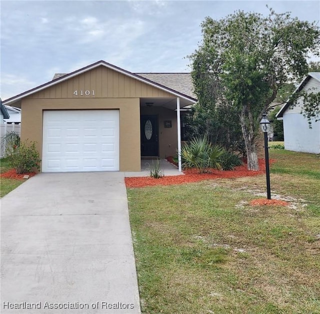 ranch-style house featuring a garage and a front yard