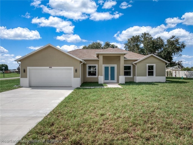 ranch-style house featuring french doors, a front lawn, and a garage