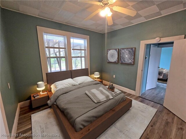 spare room featuring hardwood / wood-style flooring and ceiling fan