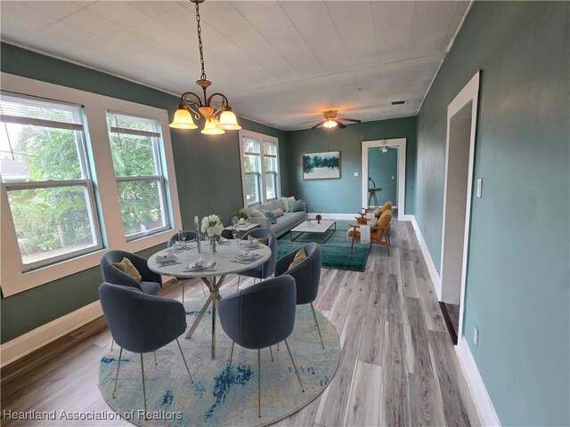 kitchen with ceiling fan, light wood-type flooring, sink, and stainless steel refrigerator with ice dispenser