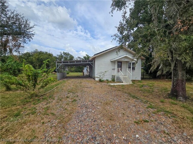 view of front of home featuring a carport