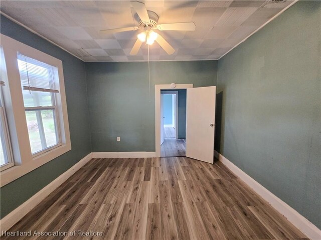 bathroom with a shower, sink, wood-type flooring, and toilet