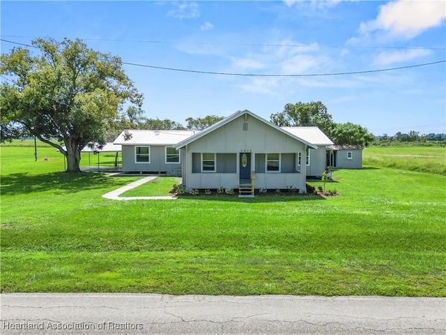 ranch-style home featuring a front yard