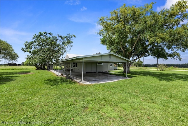 view of yard with a carport