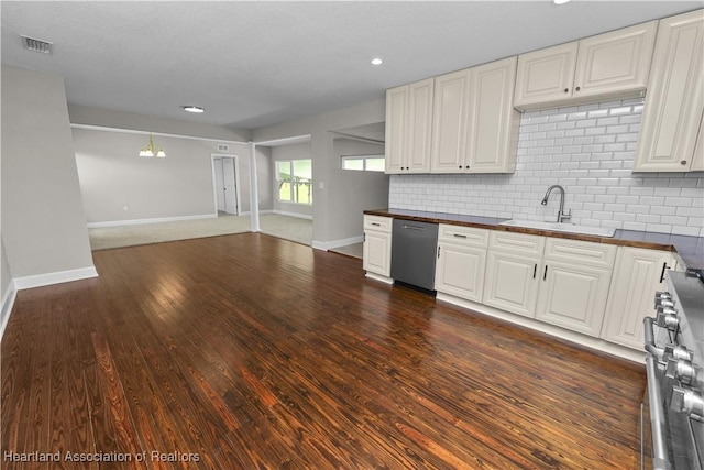 kitchen with white cabinetry, sink, stainless steel appliances, and dark hardwood / wood-style floors