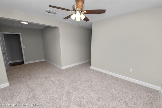 carpeted empty room with ceiling fan