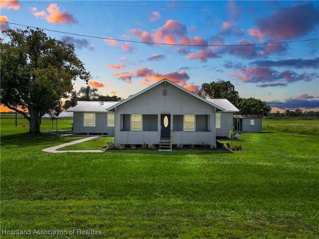 view of front of home with a lawn