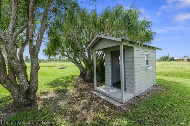 view of outdoor structure with a lawn