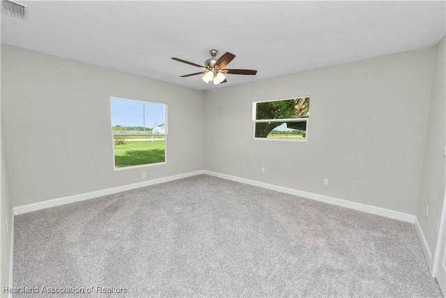 carpeted empty room with ceiling fan