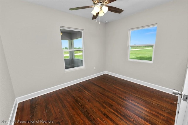 spare room with ceiling fan and wood-type flooring