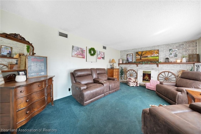 living room with carpet floors, visible vents, a fireplace, and a textured ceiling