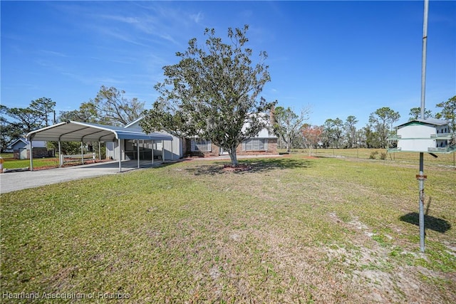 3150 Schontag Rd, Wauchula, FL 33873 - view of yard with a carport, driveway, and fence