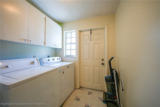 3150 Schontag Rd, Wauchula, FL 33873 - clothes washing area with cabinet space, washing machine and dryer, and a textured ceiling