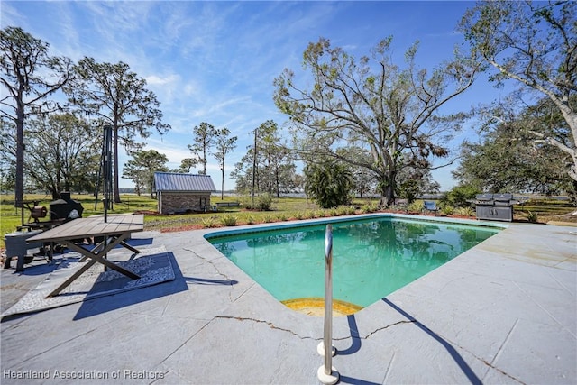 3150 Schontag Rd, Wauchula, FL 33873 - pool featuring a patio, an outdoor structure, and a storage unit