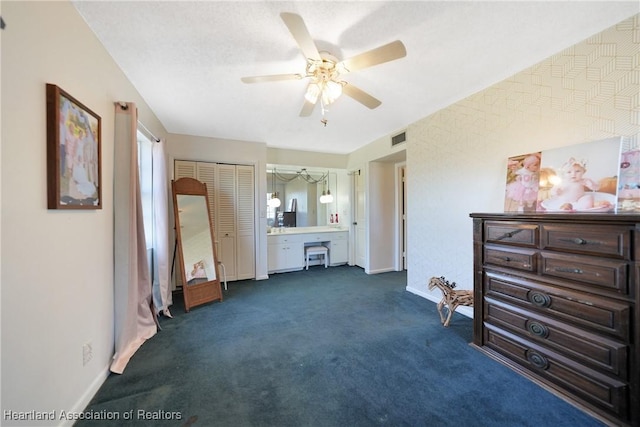 3150 Schontag Rd, Wauchula, FL 33873 - bedroom featuring dark colored carpet, visible vents, a ceiling fan, a textured ceiling, and baseboards