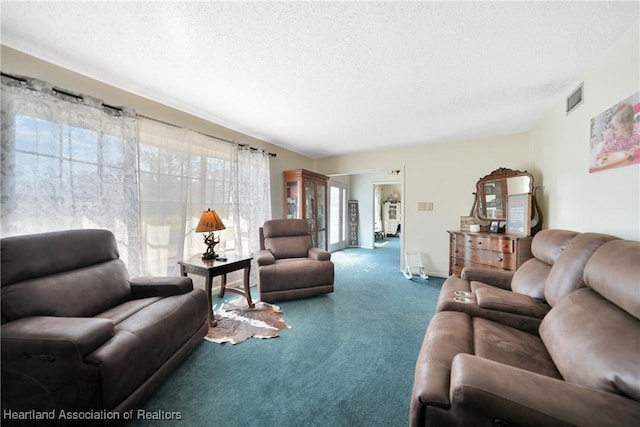 3150 Schontag Rd, Wauchula, FL 33873 - carpeted living area with visible vents and a textured ceiling