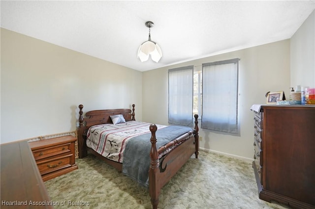 3150 Schontag Rd, Wauchula, FL 33873 - bedroom featuring baseboards and light colored carpet