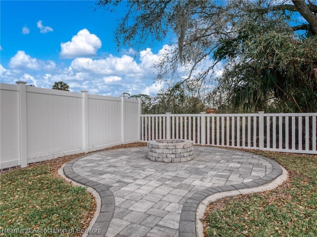 view of patio / terrace featuring fence