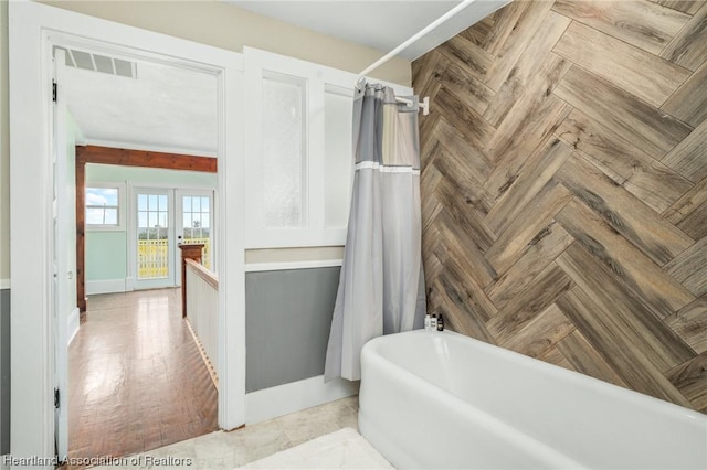 bathroom with shower / bath combination with curtain