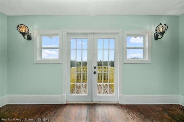 doorway to outside with dark hardwood / wood-style flooring and french doors