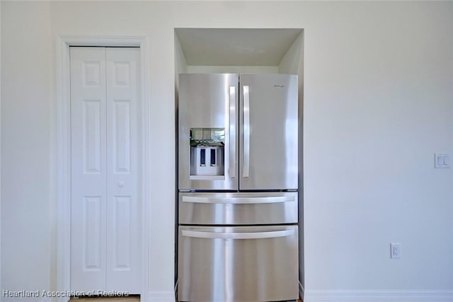 kitchen with stainless steel refrigerator with ice dispenser