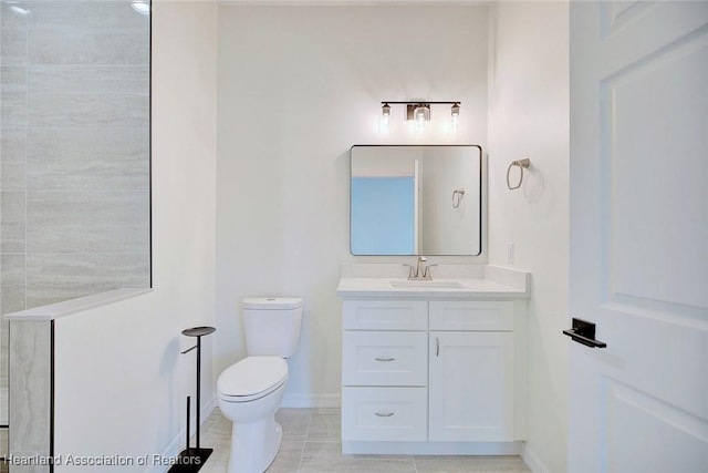 bathroom featuring tile patterned floors, baseboards, toilet, and vanity