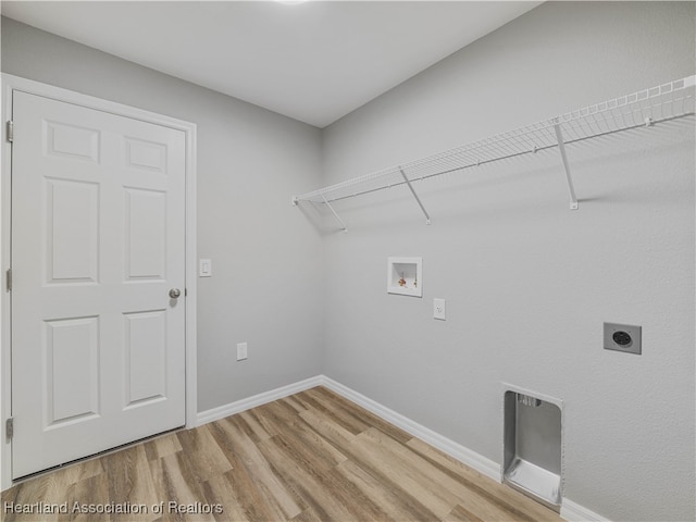 washroom with washer hookup, electric dryer hookup, and hardwood / wood-style flooring