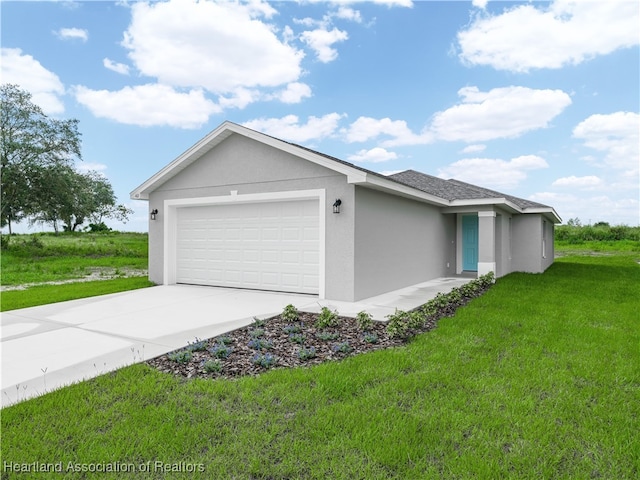 view of front of home featuring a garage and a front yard