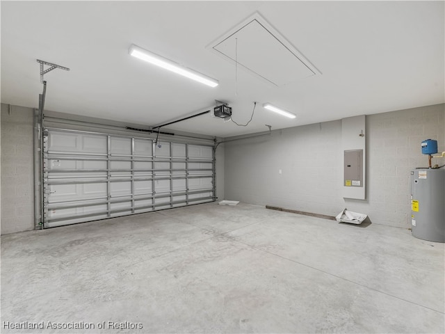 garage featuring electric panel, electric water heater, and a garage door opener