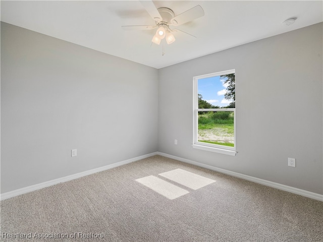 empty room with carpet and ceiling fan