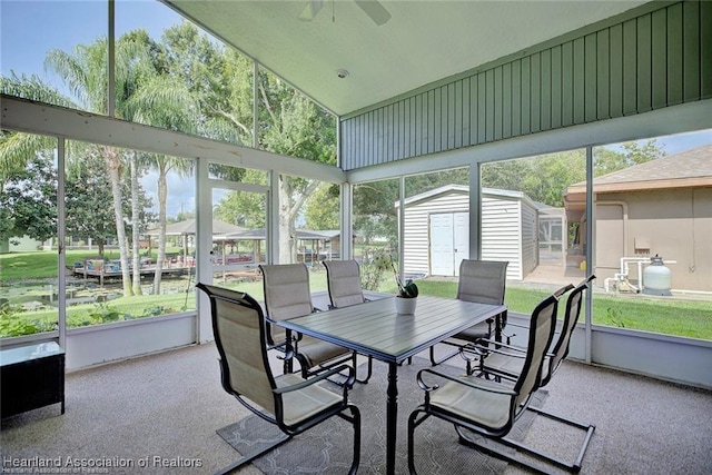 sunroom / solarium featuring ceiling fan and vaulted ceiling