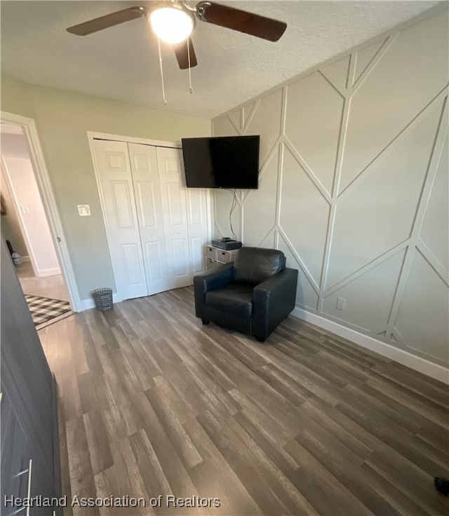 unfurnished room with hardwood / wood-style floors and ceiling fan