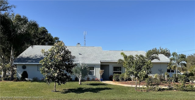 ranch-style house with a front lawn