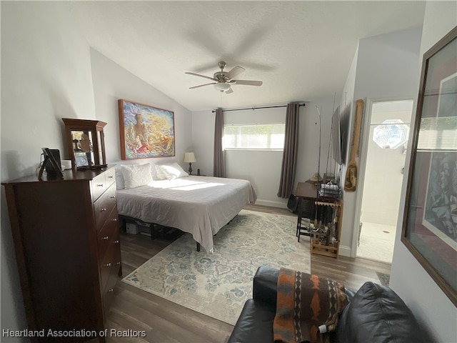 bedroom featuring ceiling fan, wood-type flooring, and vaulted ceiling