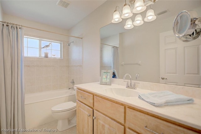 full bathroom with vanity, tile patterned floors, toilet, shower / tub combo with curtain, and a notable chandelier