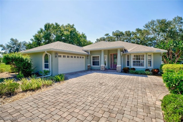 single story home featuring a garage