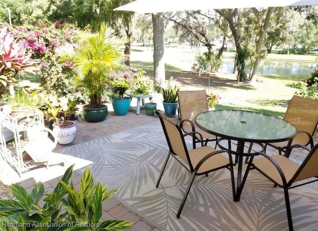 balcony featuring a patio and a water view