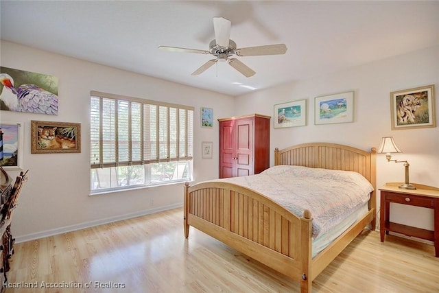 bedroom featuring ceiling fan and light hardwood / wood-style flooring