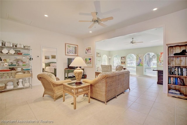 tiled living room featuring ceiling fan