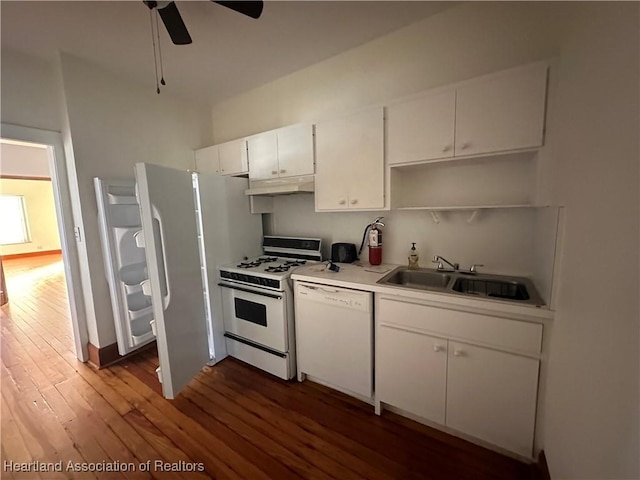 kitchen featuring white appliances, sink, dark hardwood / wood-style floors, ceiling fan, and white cabinetry