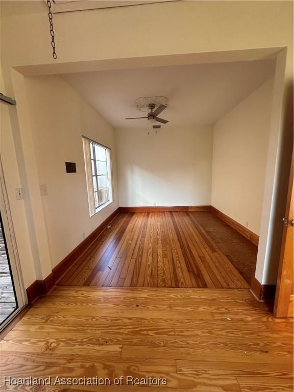 interior space with ceiling fan and hardwood / wood-style flooring