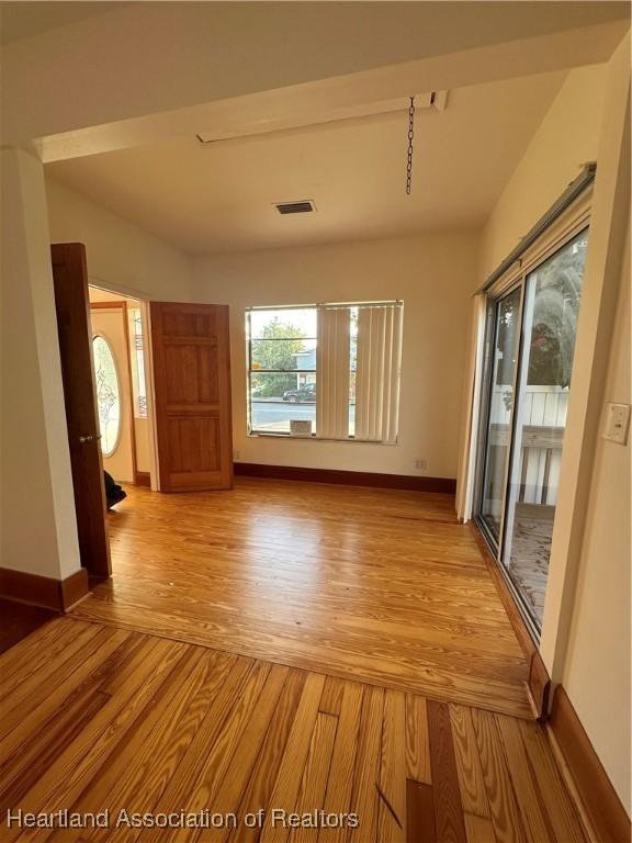 unfurnished room featuring light wood-type flooring