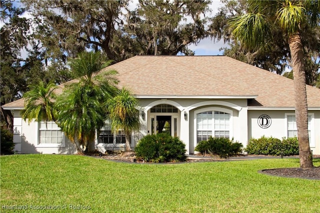 ranch-style house with a front lawn