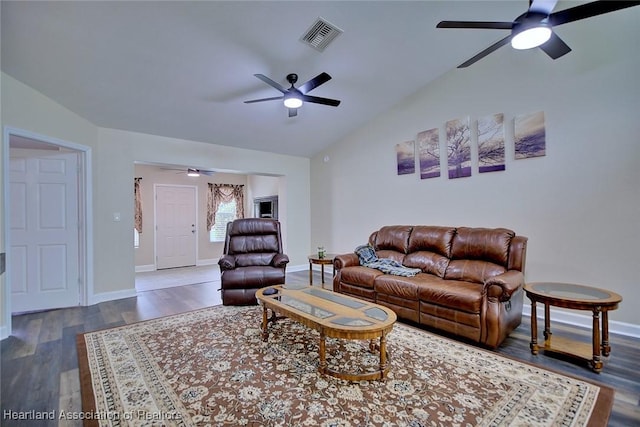 2112 Coral Ct, Sebring, FL 33870 - living room with ceiling fan, vaulted ceiling, baseboards, and wood finished floors
