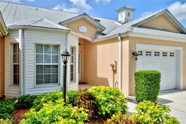 2112 Coral Ct, Sebring, FL 33870 - view of front of property with a garage, stucco siding, and a standing seam roof