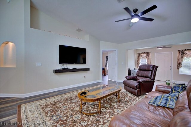 2112 Coral Ct, Sebring, FL 33870 - living room with lofted ceiling, a ceiling fan, and baseboards
