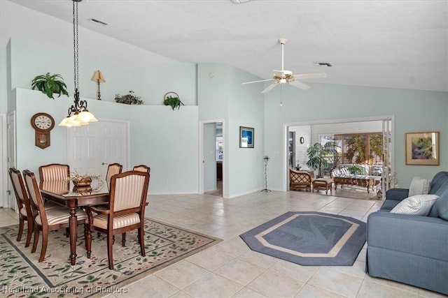 dining room featuring ceiling fan, light tile patterned floors, and high vaulted ceiling